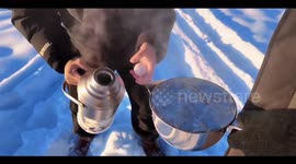 China: Stunning Golden Ice Hue Created By Combination Of Boiling Water And Freezing Temperatures