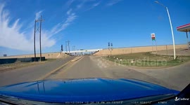 Close Call: White Vehicle Oblivious to Oncoming Traffic Almost Gets Hit