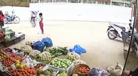 Out-of-control pickup truck crashes into fruit stall