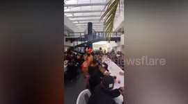 Mayor hot under collar as skimpy Santa stripper dances at packed police party