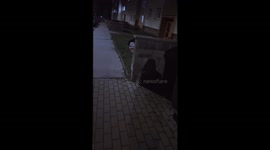 Scary figures outside at night on a housing estate.