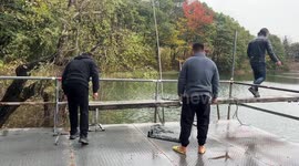Man falls into water while trying to balance plank in Zhejiang, China