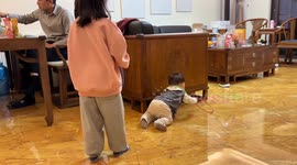 Older sibling plays game with younger sibling in Shanghai