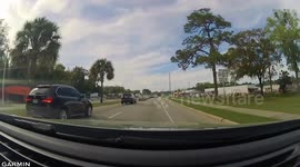 Close Call: Red Vehicle Almost Crashes Into Oncoming Car