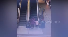 Old woman with walking cane tumbles on escalator and drags granddaughter along