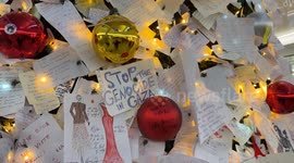 A wish card bearing the words ‘stop the genocide in Gaza’ was hung among other wish cards on the decorated Christmas tree installed at Termini Station during the Christmas season in Rome.