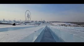Sliding through snow slide at snow theme park in Heilongjiang, China