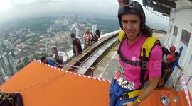 Douggs & wife Jenny jump off building holding hands