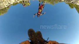 BASE jump front loop from beach cliff POV camera