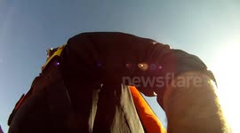 Cliff BASE jump with Douggs, hand camera angle in Moab