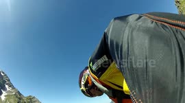 Base jump Wingsuit Proximity flight past a building. Douggs Hand camera angle