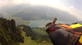 Wingsuit Proximity BASE jump through the crack Douggs hand camera angle