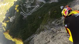 Wingsuit proximity base jumping in China with Douggs following JT Holmes hand camera angle