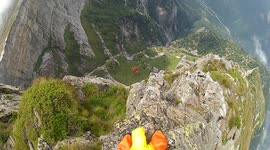 Wingsuit proximity BASE jump near Italian border with Douggs POV camera angle