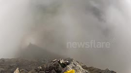 Big wall BASE jump flying through new crack Douggs POV camera angle cloudy day