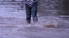Kid Plays in Denver Flood on Peoria Avenue