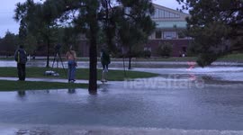 Onlookers watch Denver Flood Take out Neighborhood