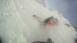 Dramatic snowmobile crash caught on GoPro camera
