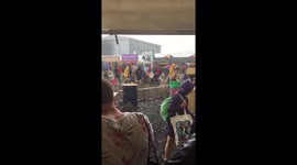 Torrential downpour of rain catches people off guard at Glastonbury Music Festival 24/06/2016