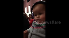 Baby headbangs to church worship songs