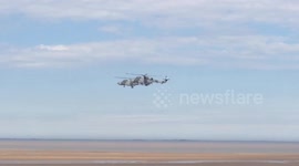 Helicopters fly backwards at Armed Forces Day in Cleethorpes, UK
