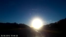 Driving towards a brilliant sunset