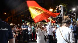 Popular Party supporters tease homeless protestors waving Spain flag