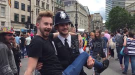 Ridiculously good looking cop hugged at Gay Parade 2016