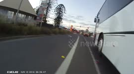 Cyclist Near Misses a Bus