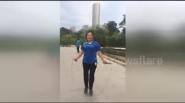 Woman dances while skipping ropes with music