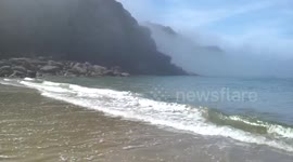 Beautiful fog clouds roll across the sea in Cornwall, UK