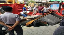 Forklift falls into sinkhole in China