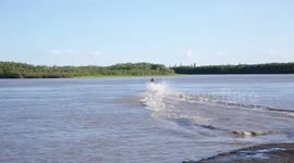 Snowmobile Skipping on the Peel RIver