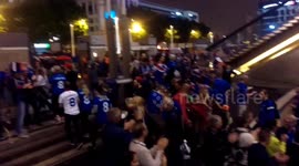 French supporters cheer and clap as Icelandic fans leave stadium