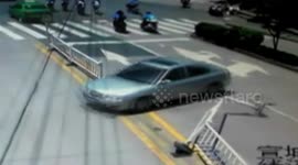 Reversing car crashes into shop