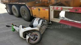 Moped driver narrowly escapes being crushed by lorry