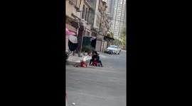 Older brother helps sibling after fall in Guangzhou, China
