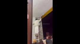 Student successfully rescues kitten stuck in ceiling in Sichuan, China