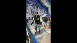 Father and son slip and fall on ice skating rink in Gijón, Spain