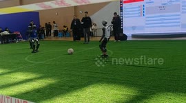 Robots compete in football match in Shandong, China
