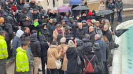 Mayor of Rome Roberto Gualtieri speaks to citizens and tourists attending the inauguration of the Trevi Fountain following the Jubilee cleanup on a rainy December day in Rome.
