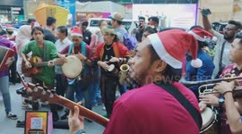 Street Performers perform Xmas Song with variety of music instruments and costumes
