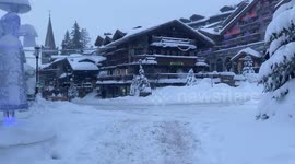 The heart of village Courchevel under a heavy snowstorm