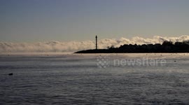 Freezing temperatures in Massachusetts create sea smoke on Marblehead Harbor