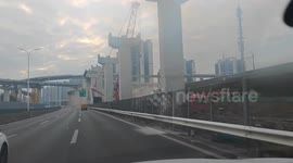 Crane collapses onto moving train full of passengers in China