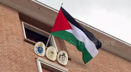 The Palestinian flag flies from the window of the Embassy of Palestine to the Holy See the day before the start of the Jubilee in Vatican City.