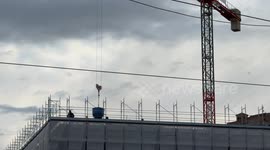 Workers at work on one of the roofs of the Vatican City the day before the start of the Jubilee in the Vatican City.