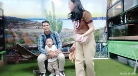 Toddler stays remarkably calm while handling huge python