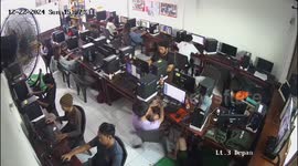 Guy falls off chair while gaming at internet cafe in Bandung, Indonesia