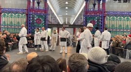Hundreds of people at Smithfield Market Christmas Eve Meat Auction 2024 In London